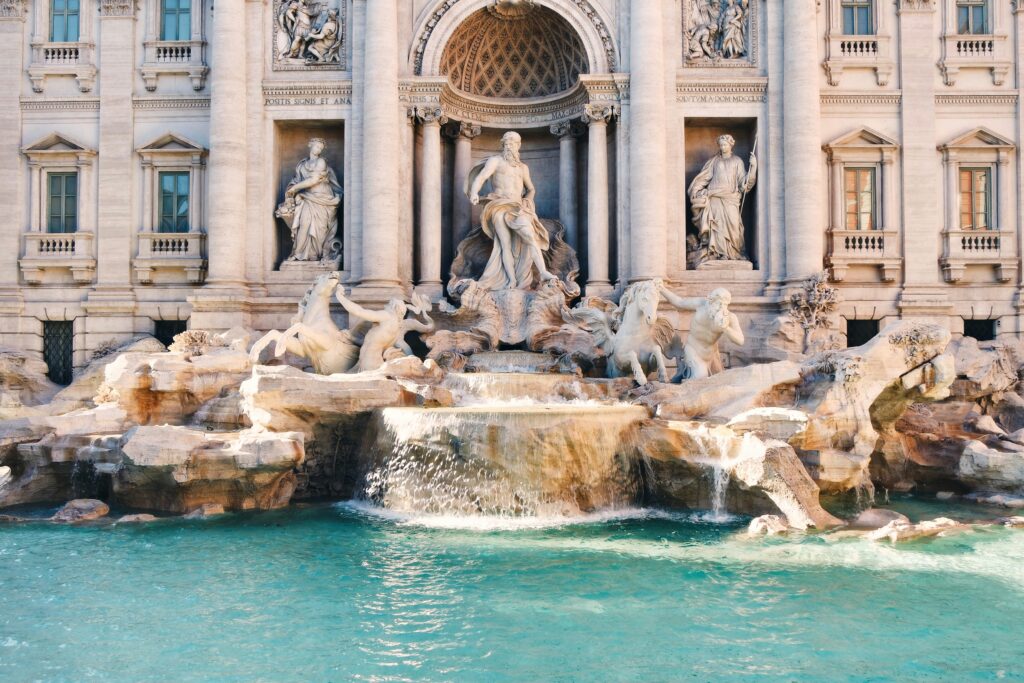 Trevi Fountain in Rome with blue water during a quiet morning walk for couples